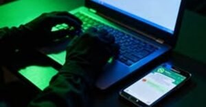 WhatsApp Web cyber attack in Pakistan: hacker using a laptop and phone
